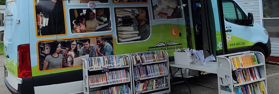 The Montgomery-Floyd Regional Library (MFRL) bookmobile parked outside the libary offering books and printing with Princh.